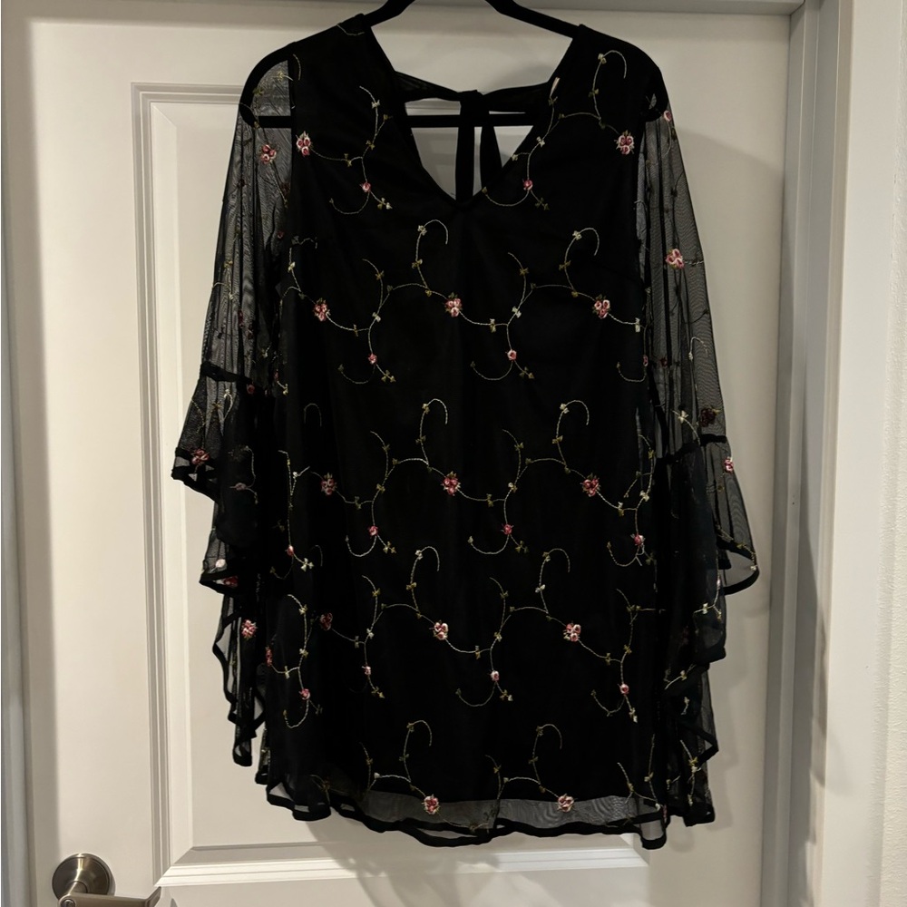 black flowy embroidered red mini dress with mesh cape sleeves